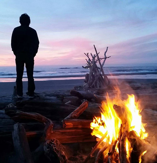 Matt Love on Beach with Bonfire